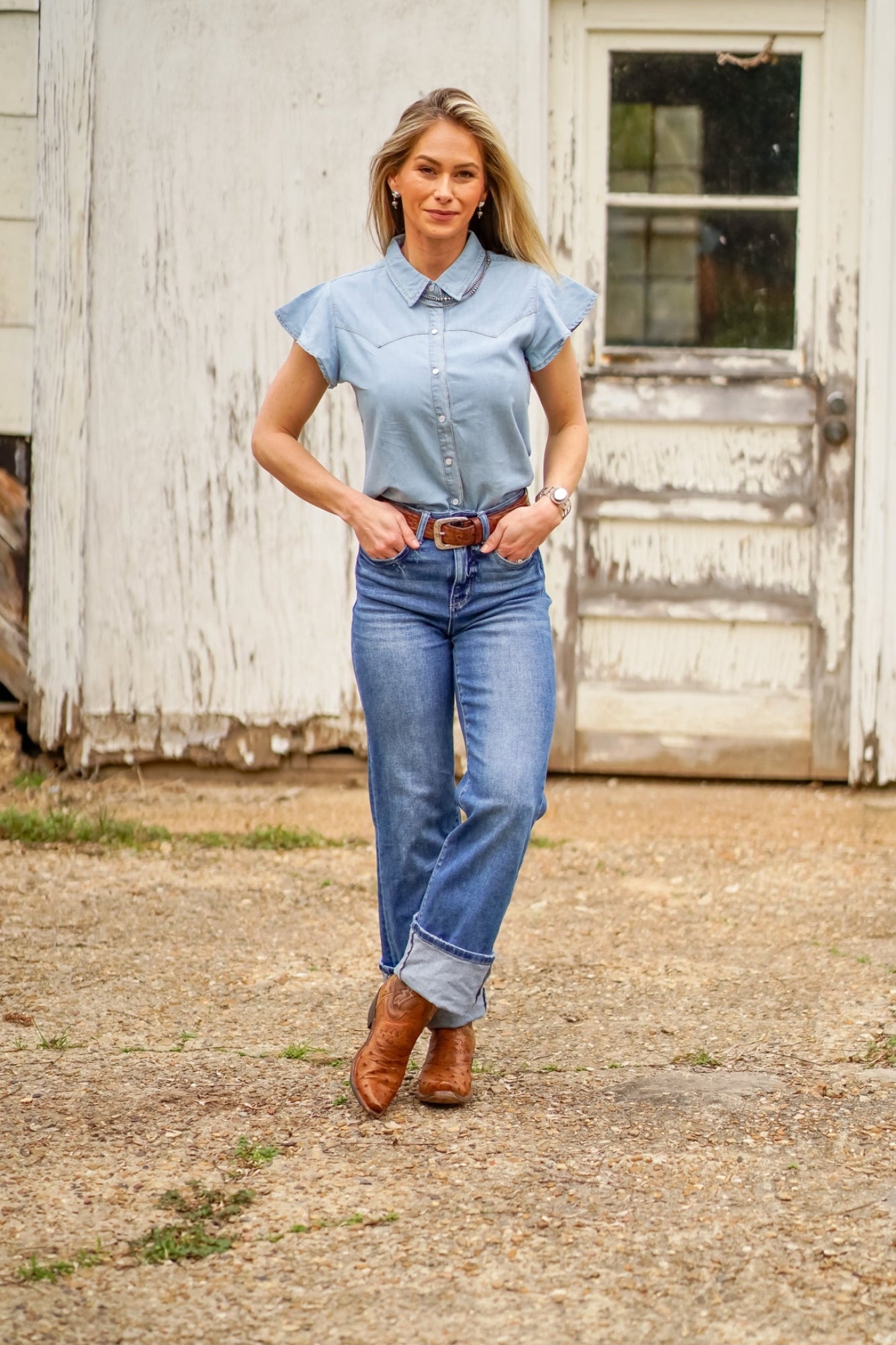 Light wash pearl snap denim button down. Feminine soft denim